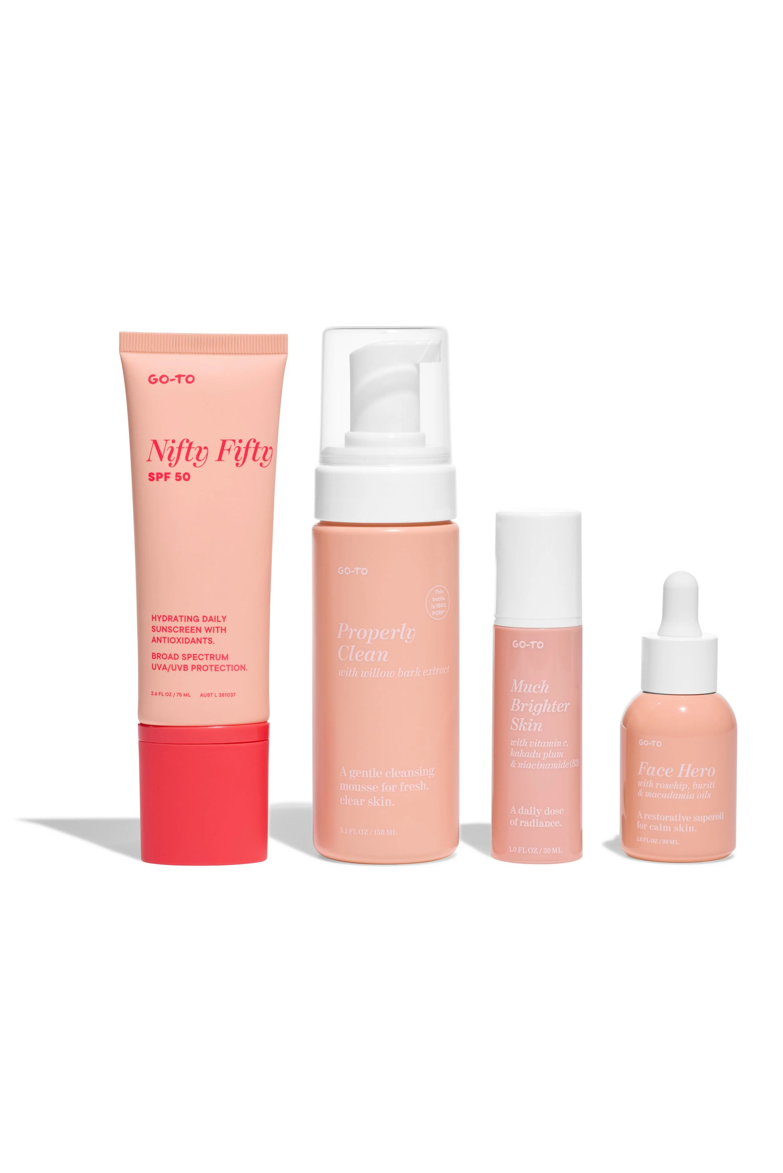 Collection of skincare products including sunscreen, cleanser, serum, and moisturizer in pink and white bottles against a white background.