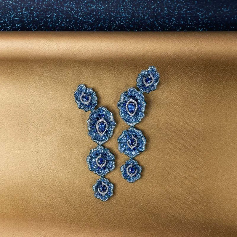 VANLELES-Fleur de Sable-18 karat gold-titanium-diamonds-blue sapphire-earrings STILL.jpg