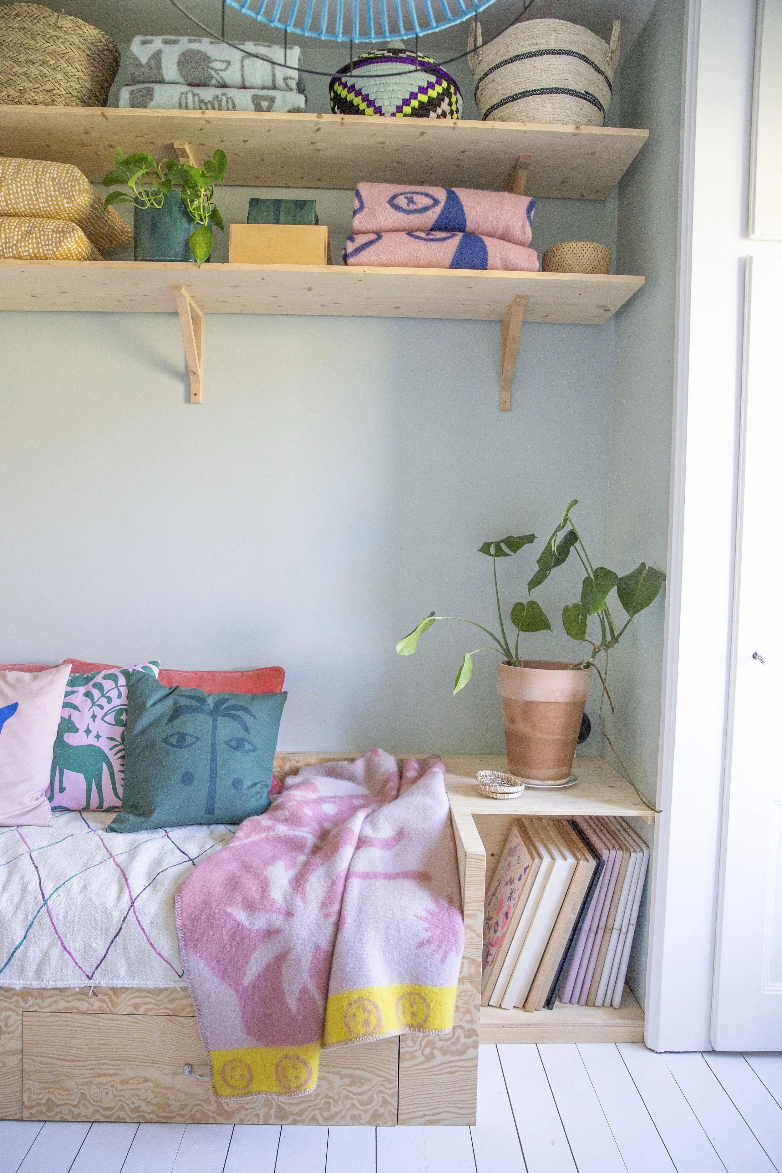  The tiny apartment showroom with  wool blankets  and  cushion covers  on display 