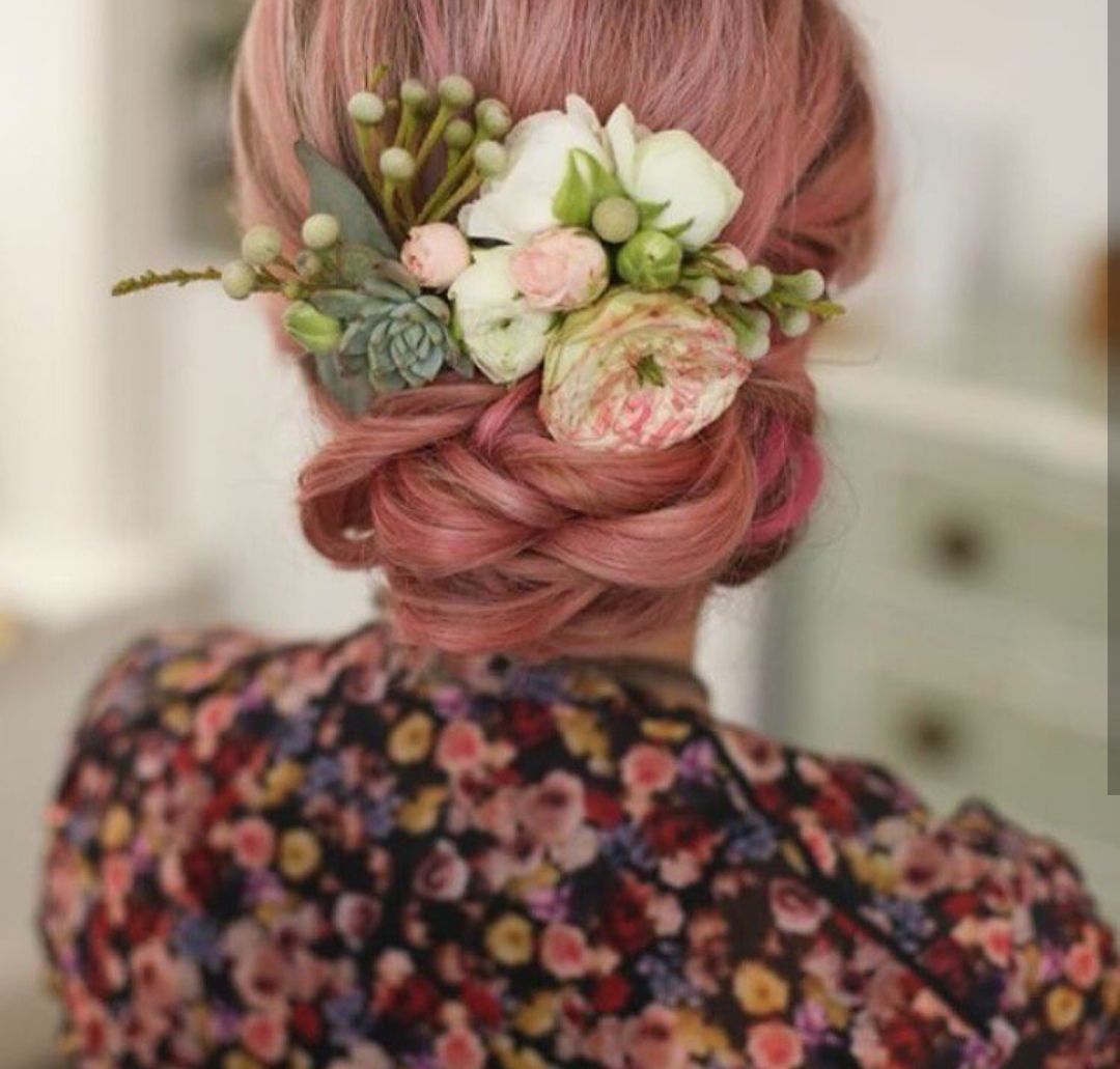 Low updo with fresh flowers