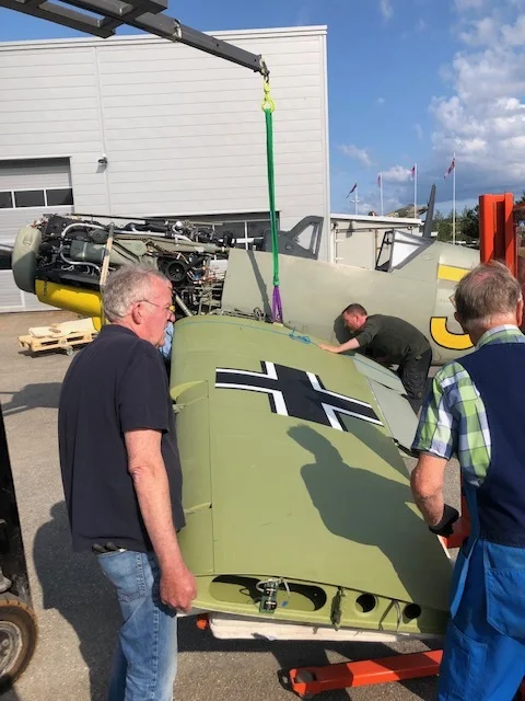 Conservator Michael Loftus carefully adjusting the wing millimeter by millimeter