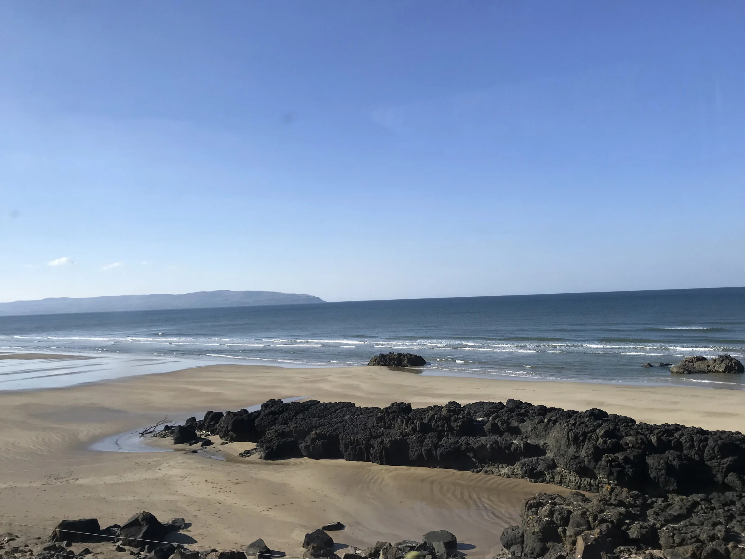 View from the train, emerging from the tunnel at Castlerock.