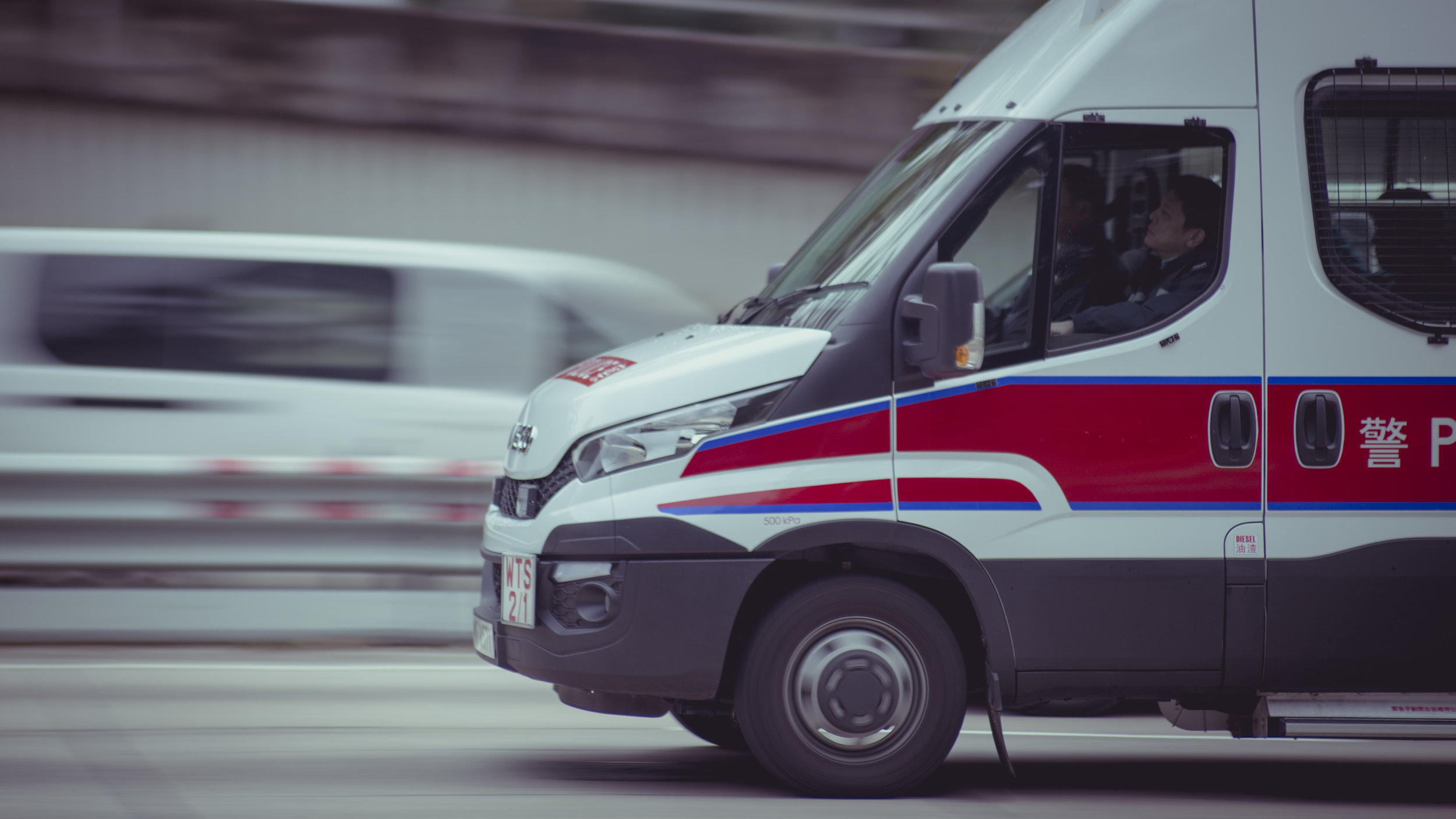 An ambulance driving on a highway