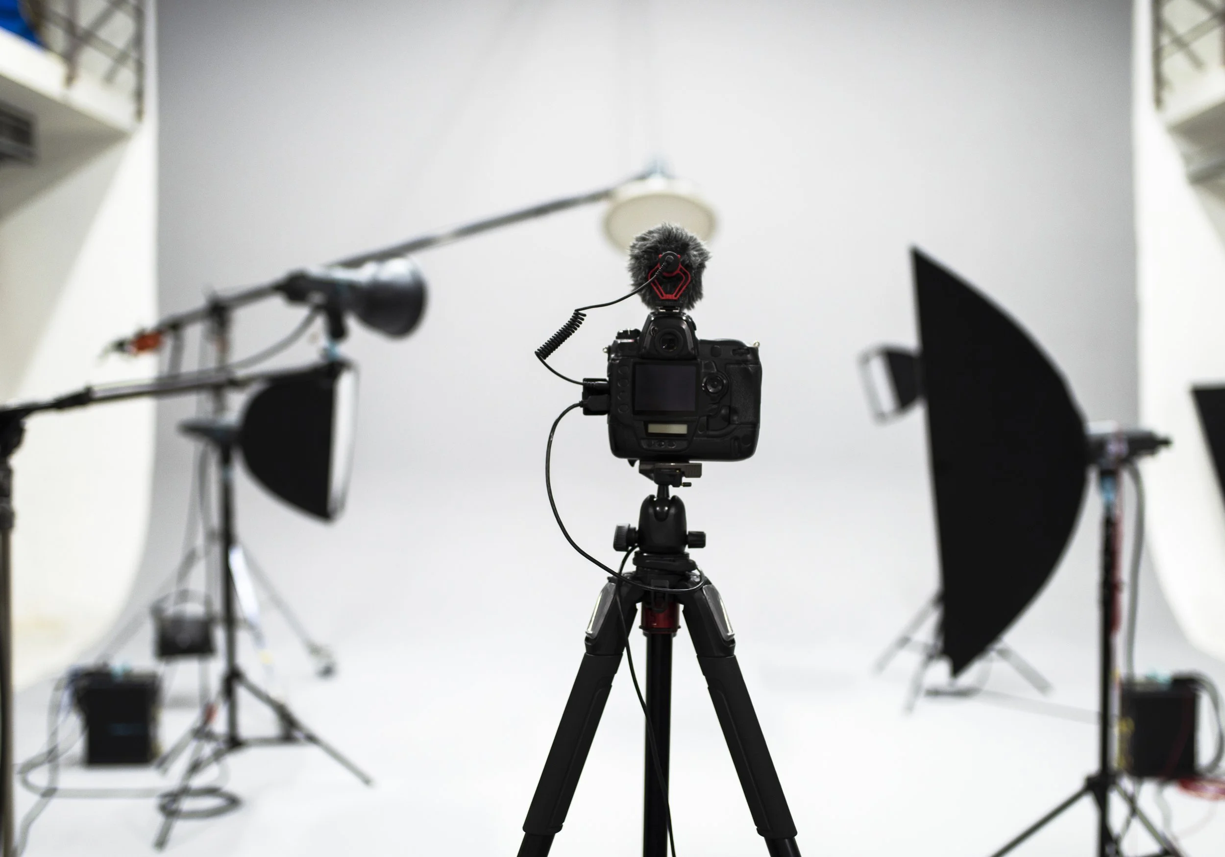 A camera set up in front of a photography set.