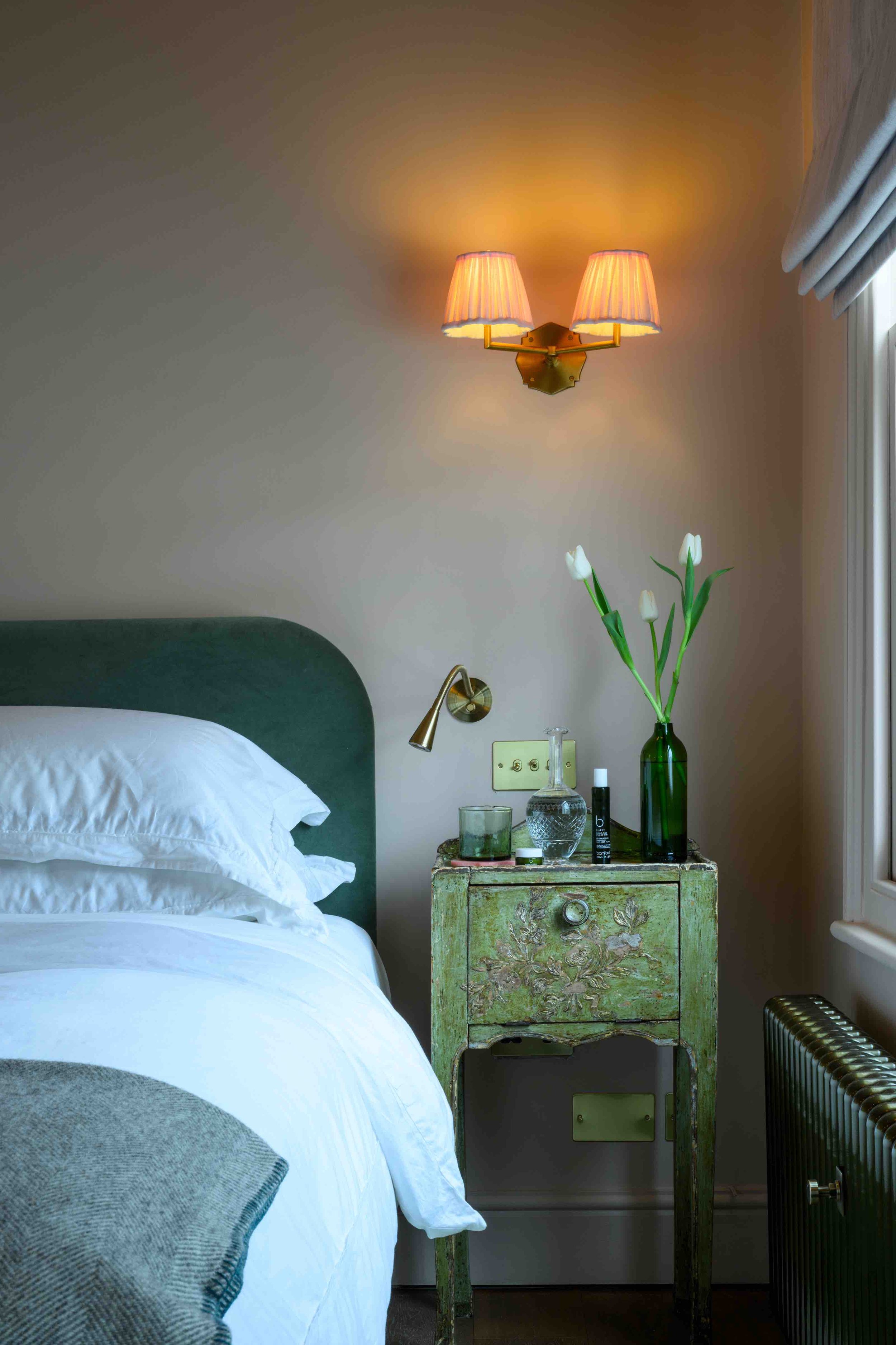 Bed and beside table with radiator detail.jpeg