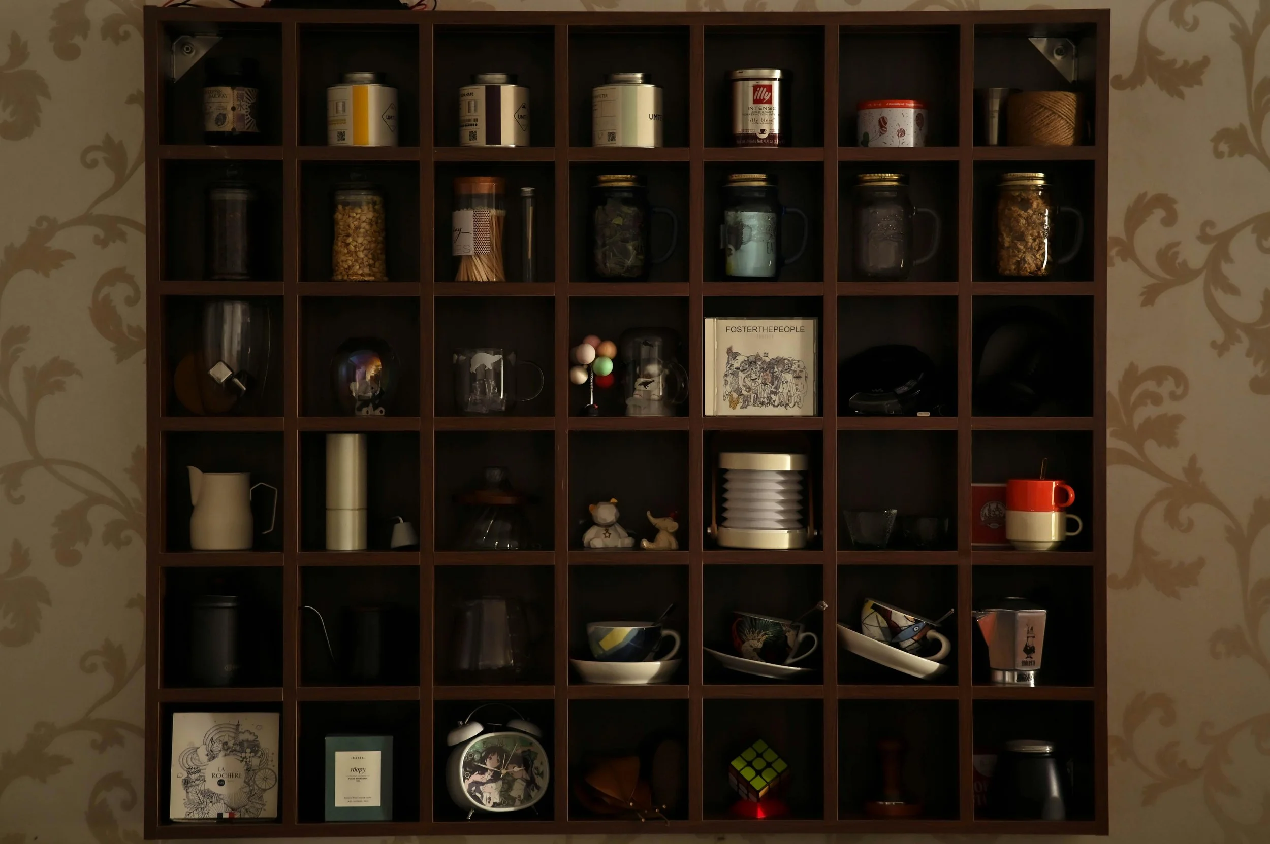 A beautifully organized cubby shelf with only thoughtfully chosen everyday items, reflecting the peace that comes when your space supports what you need right now.