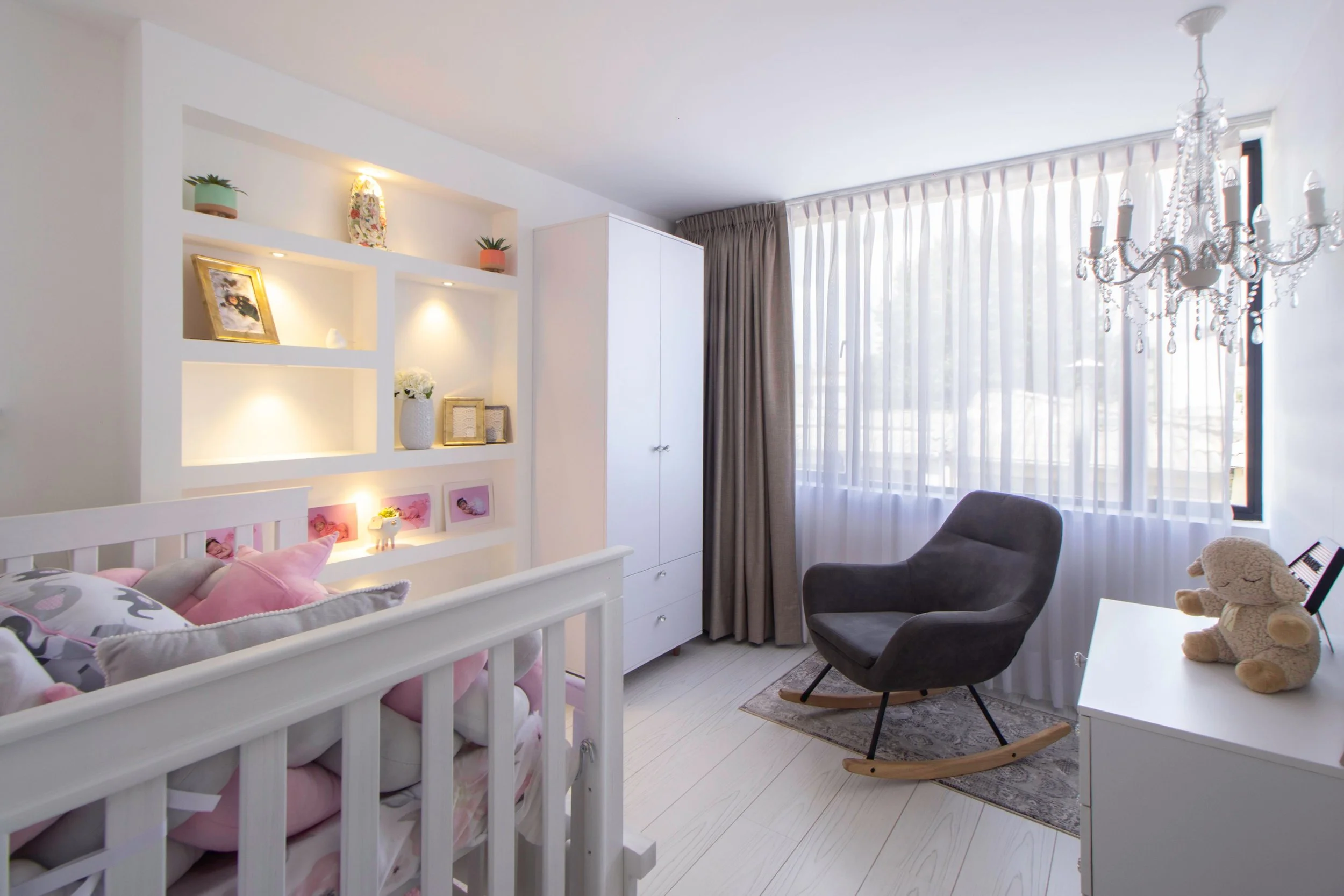 Peaceful, organized nursery with open space, showcasing how thoughtful organization makes room for everyday moments that matter most.