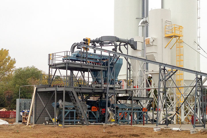  This shows the heart of the vertically stacked separation system which features multiple vibratory screeners and air classifiers with the separated materials being pneumatically conveyed to the silos, a compactor and roll off boxes. 