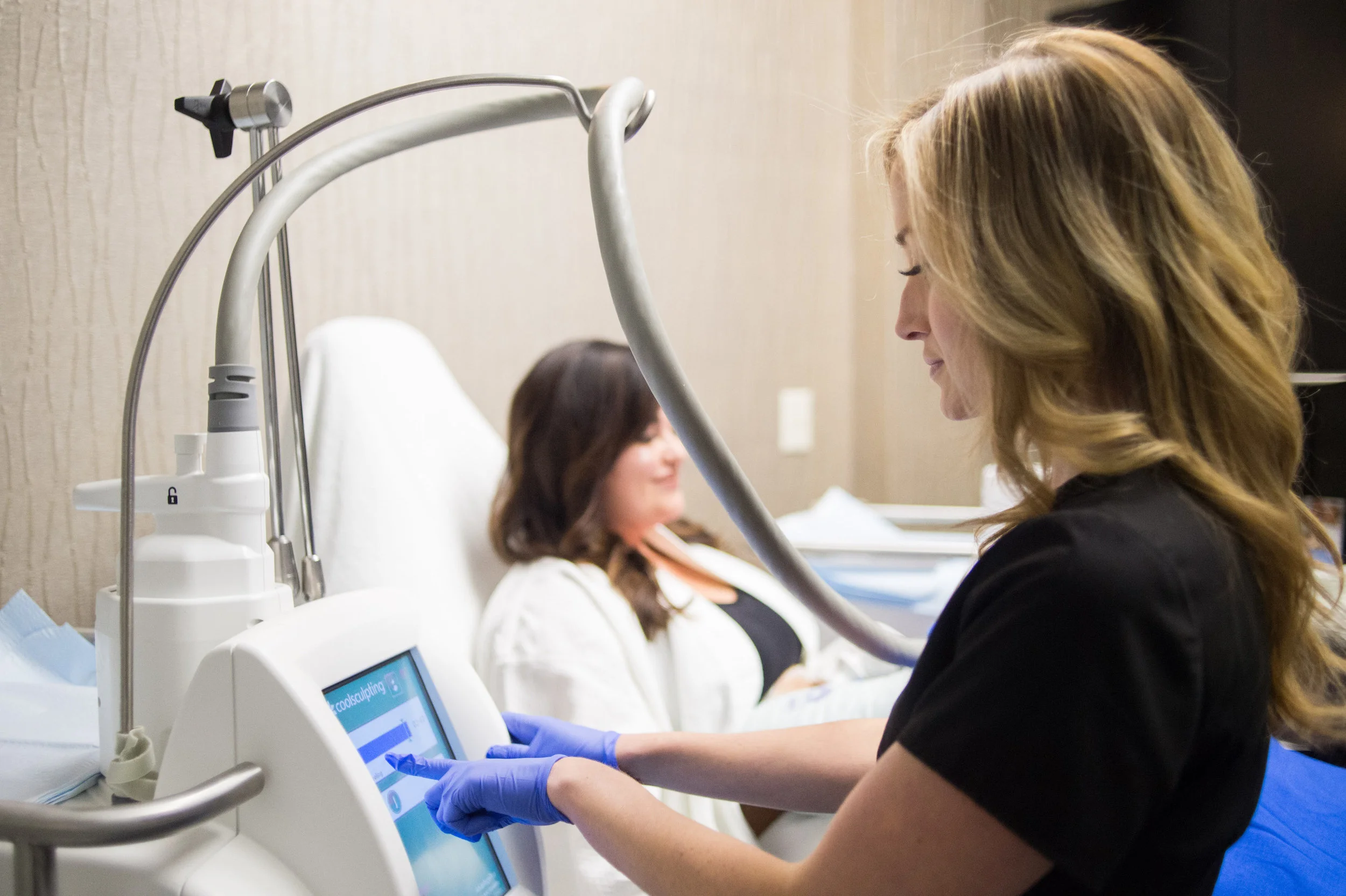 Patient receiving treatment at a Live CoolSculpting Demonstration.