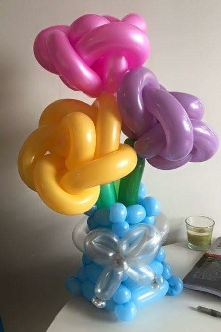Bouquet. Classic bouquet with woven base and bow accent in Vibrant with rose substitution.jpg