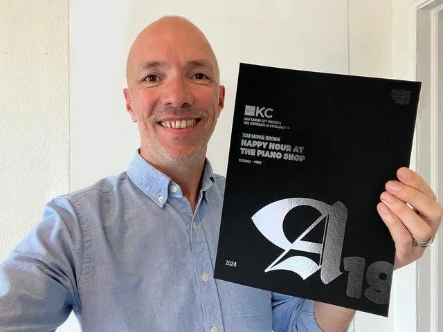 Me holding the 2023 award