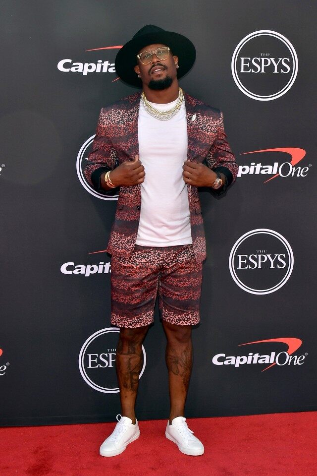 Broncos linebacker Von Miller in a ombréd pattern short with matching blazer from Chandra Ferrer . Jason of Beverly Hills chains and Gladys Tamez hat.
