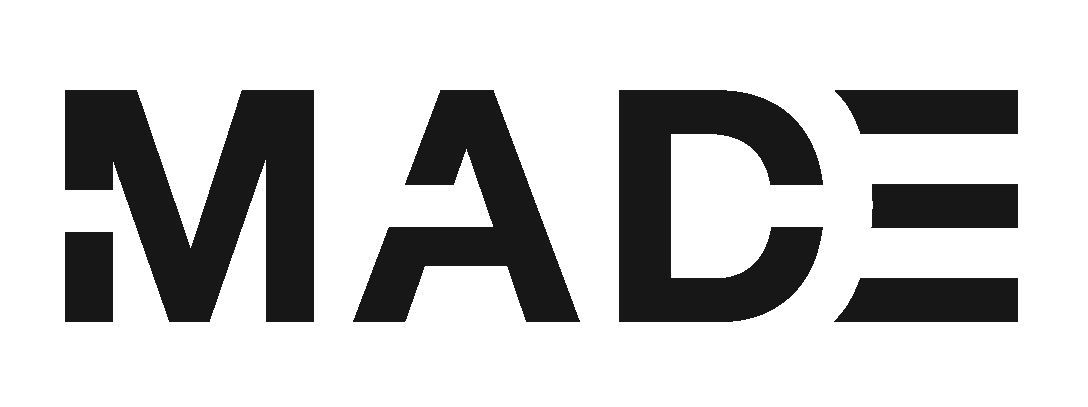 Black text on a white background that says "MADE" in bold, uppercase letters.