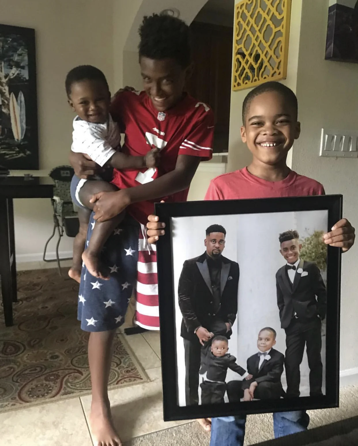 The Palmers’ three boys gifting Donte with a fathers day gift!
