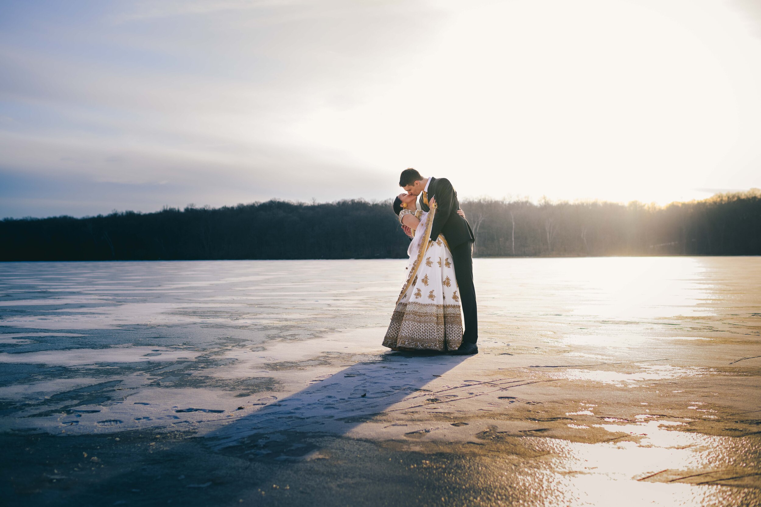 Couple kissing on the ice at Maplelag Resort in Callaway, MN
