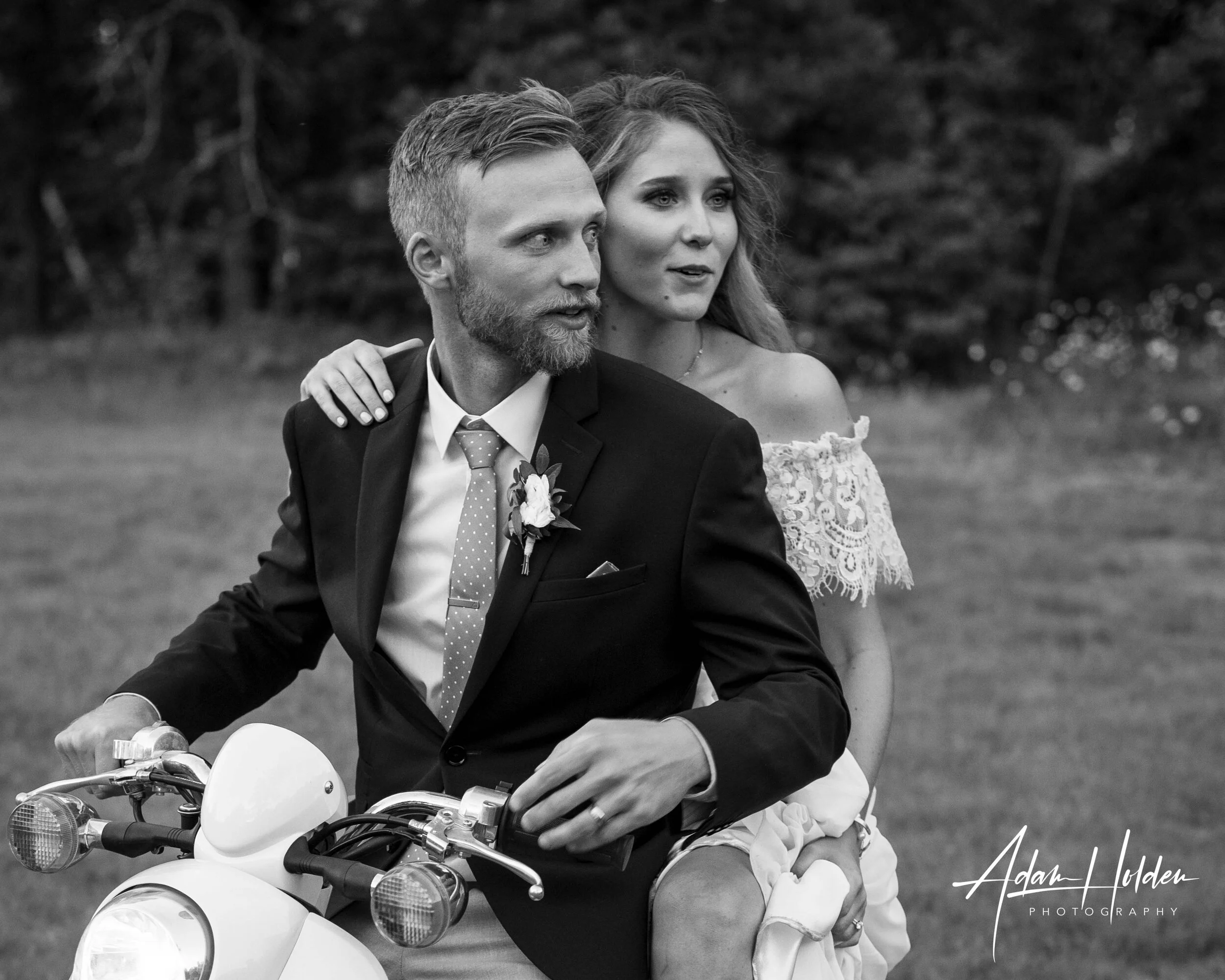 Bride and groom sitting together during a wedding portrait session at The Atrium in Solon Springs, WI