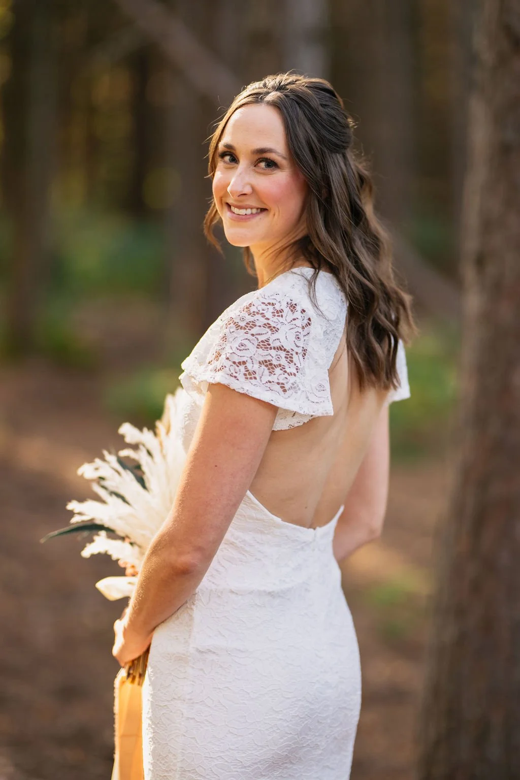 Bride looking back over her shoulder during a North Shore Lake Superior elopement portrait