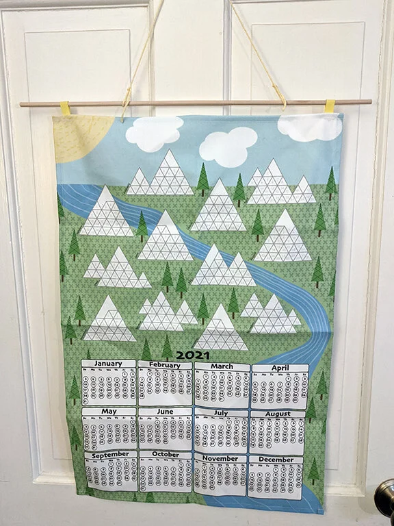 My tea towel is hanging in my exercise space.  These happy colors will make my workouts a little more enjoyable.