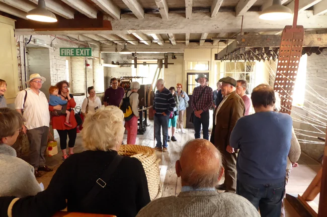 A guided tour of the ropery led by the entertaining and knowledgeable gentleman in the cap.