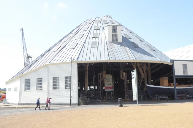 These modern looking so-called covered slips date from late Victorian times and built mostly from wood. They were used for ship construction under cover and now house a large collection of marine craft, including lifeboats.
