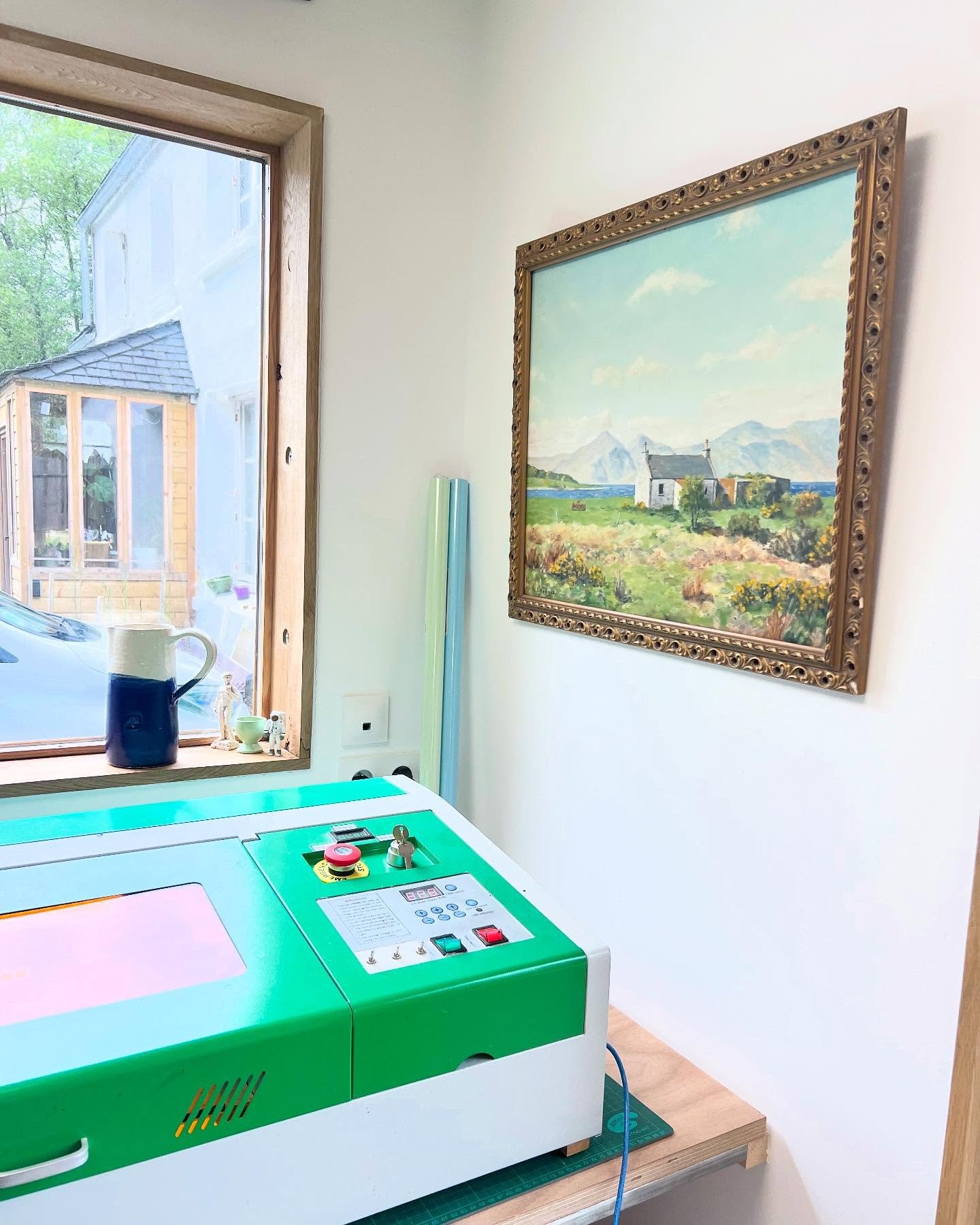 I&rsquo;ve got a whole lot of laser cutting to do this week so you&rsquo;ll mostly find me in this corner of the studio! The painting was done by my great grandad of a little house in Scotland, but I think it looks just like *our* house here in Franc