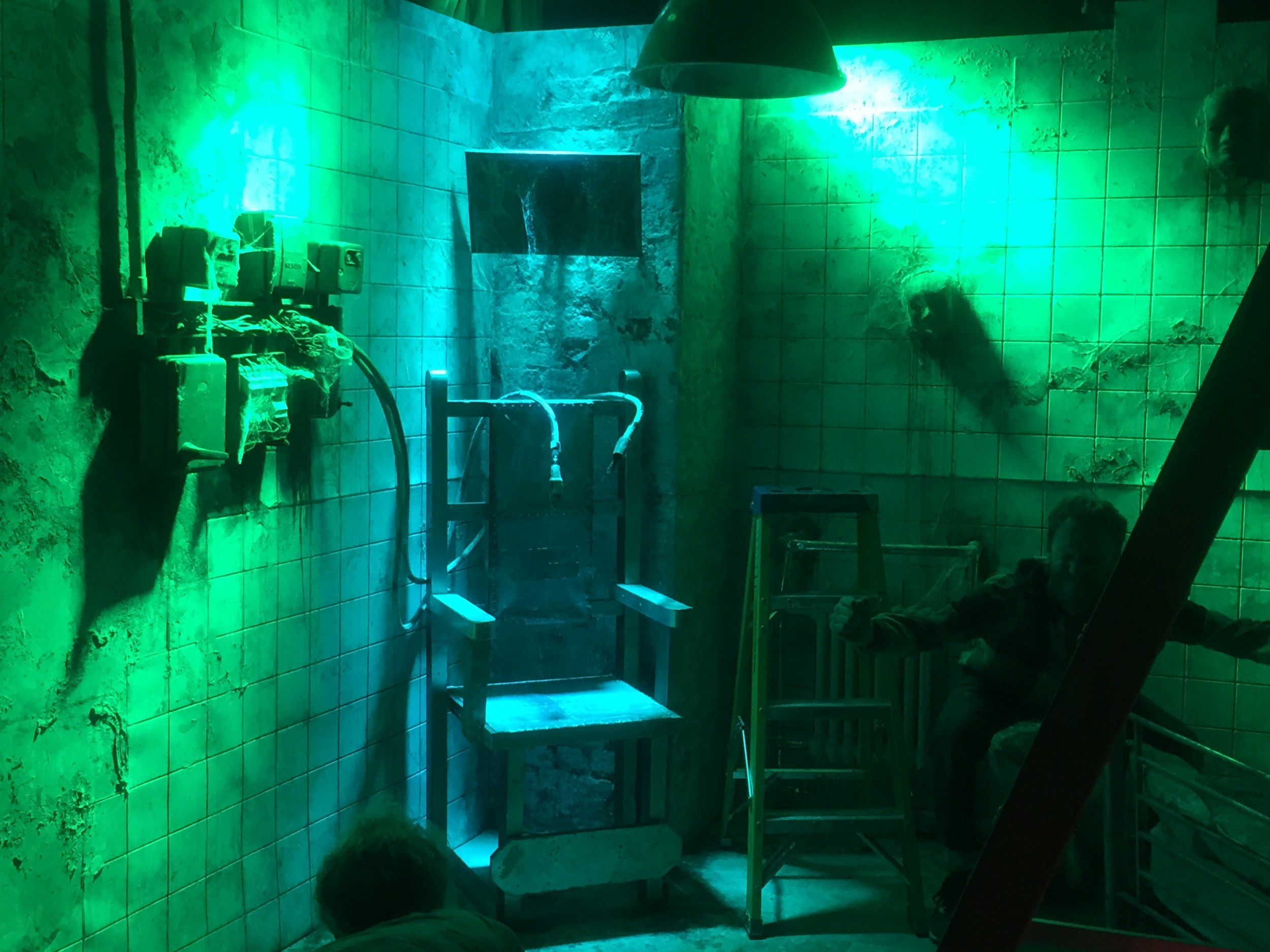 Electric chair lit in blue and green