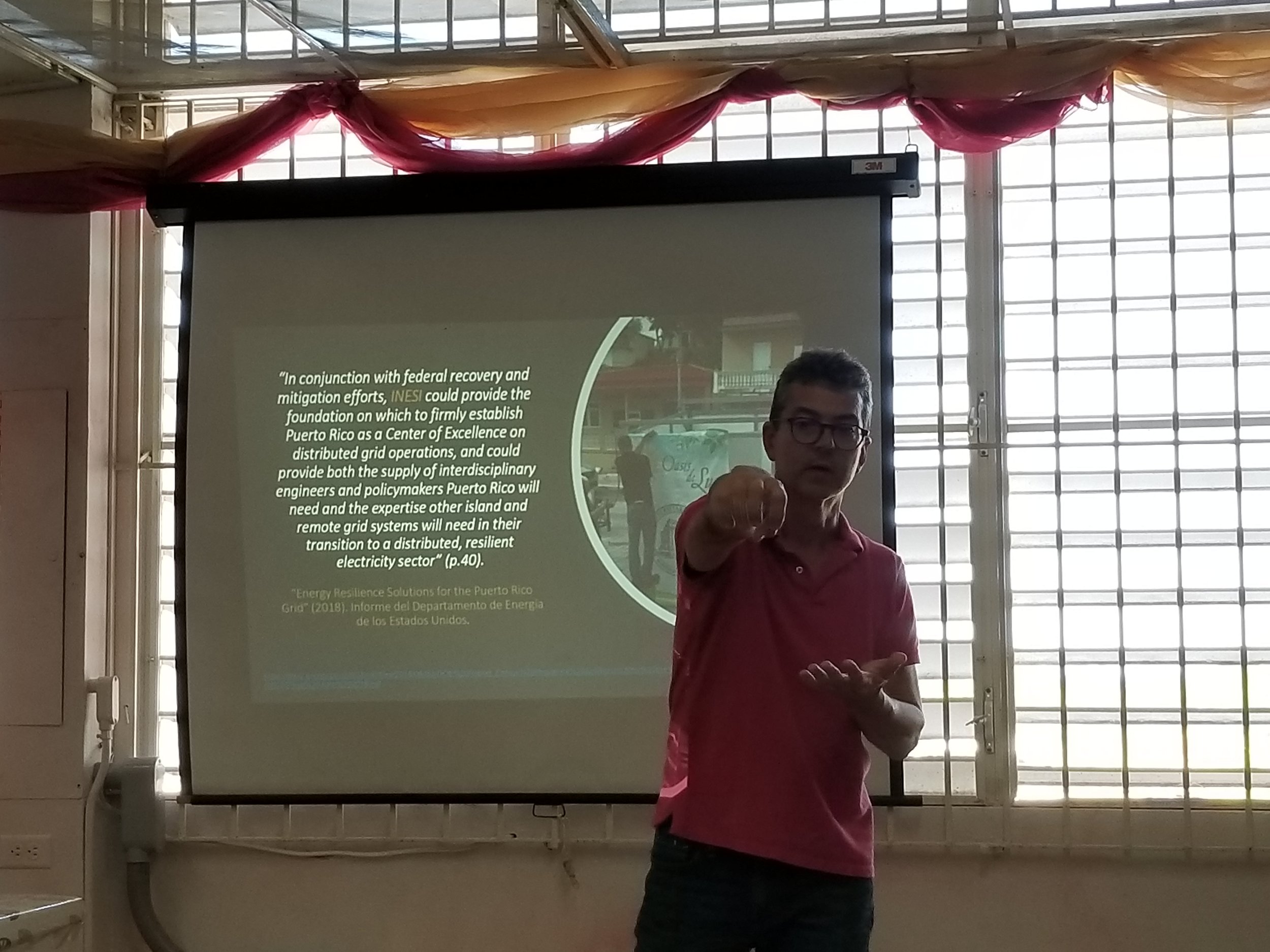 Prof. Orama discussing puerto rico’s energy transition with the class