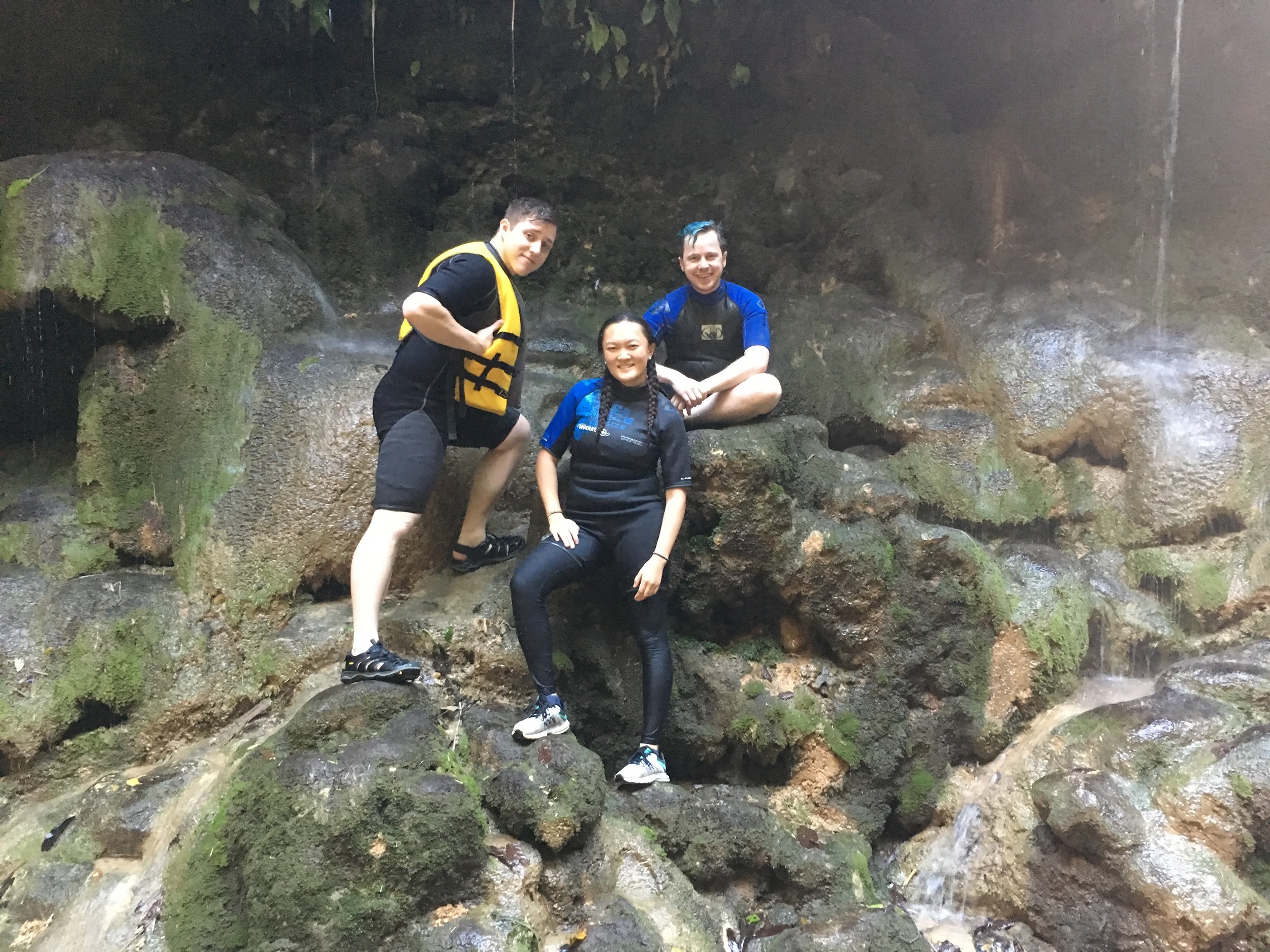 Group Picture outside natural spring waterfall
