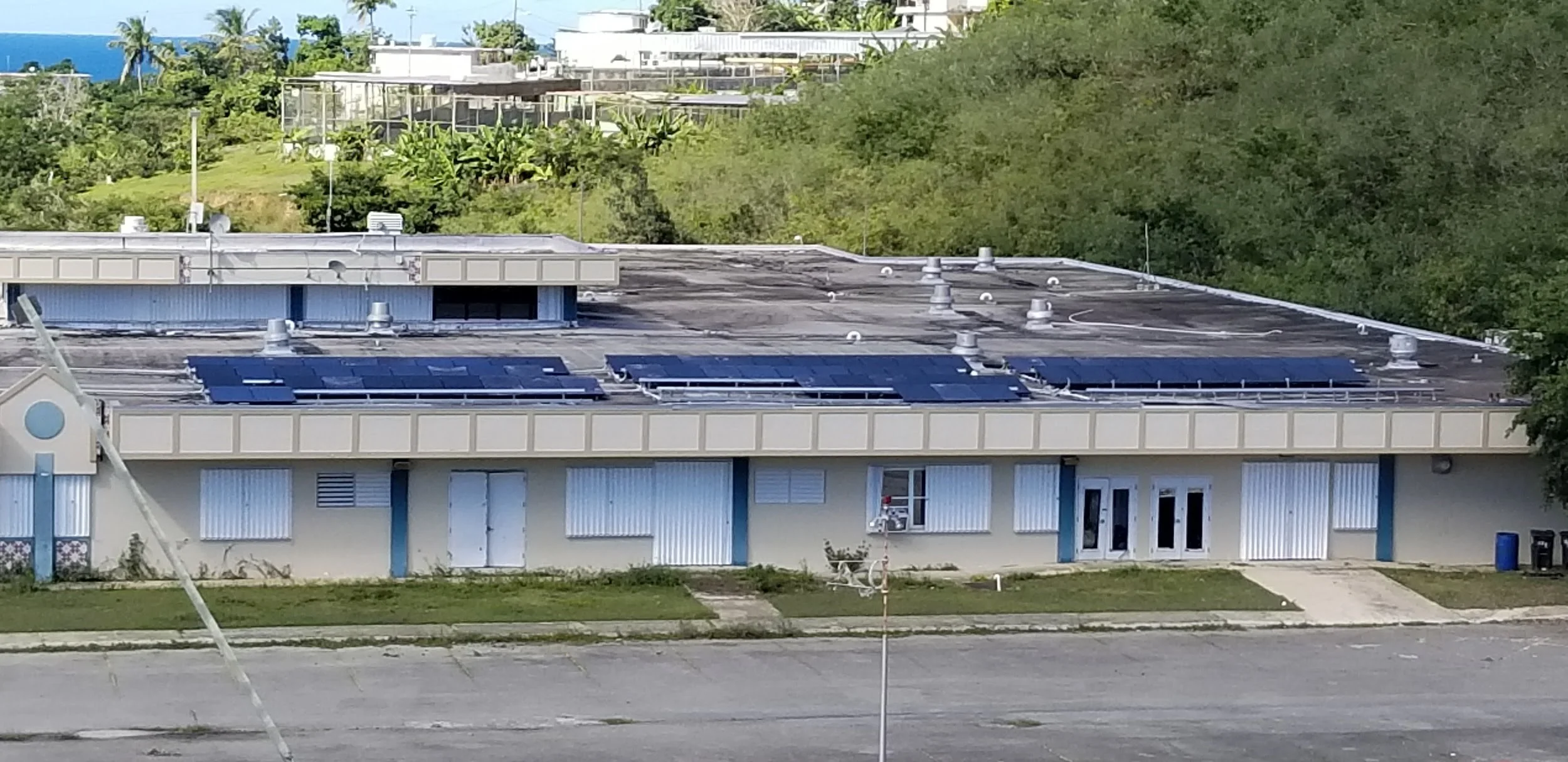 tesla solar panels on the roof of the hospital in vieques, now closed due to black mold