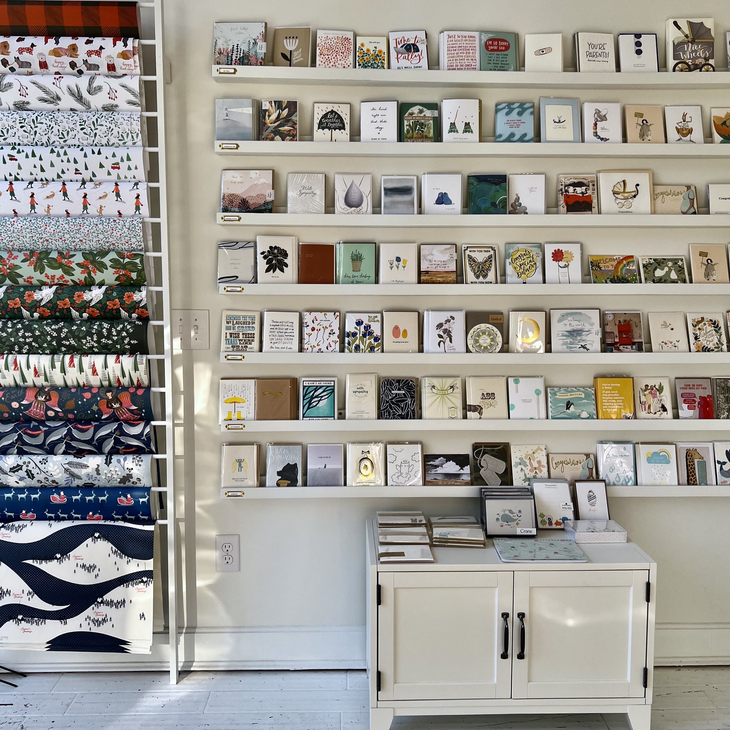 Wall of greeting cards at Poeme