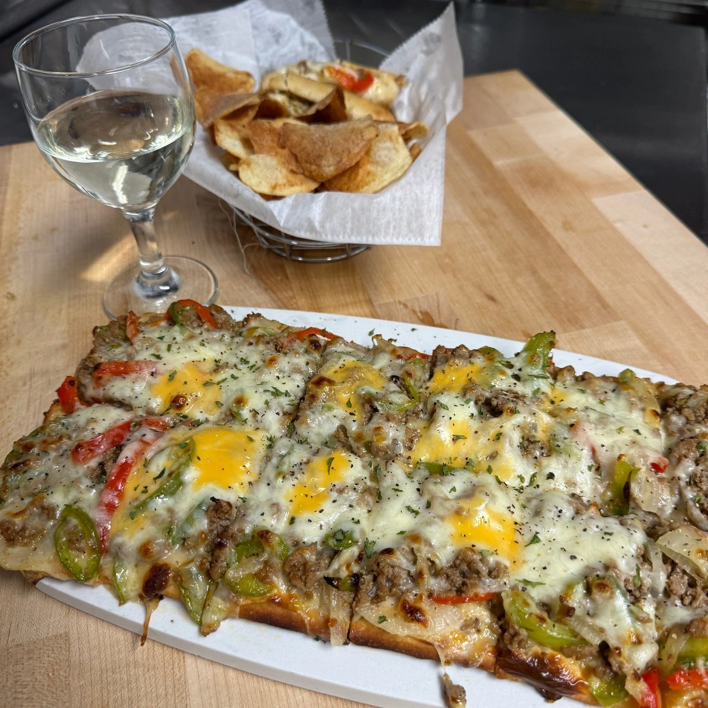 It&rsquo;s Philly Friday at the Bistro at Village Wine! Philly Flatbread with queso sauce, juicy thin sliced steak, peppers, and onions with our cheese blend. $19 feeds 2 or more. Then our Philly Panini with the same great stuff panini pressed on our