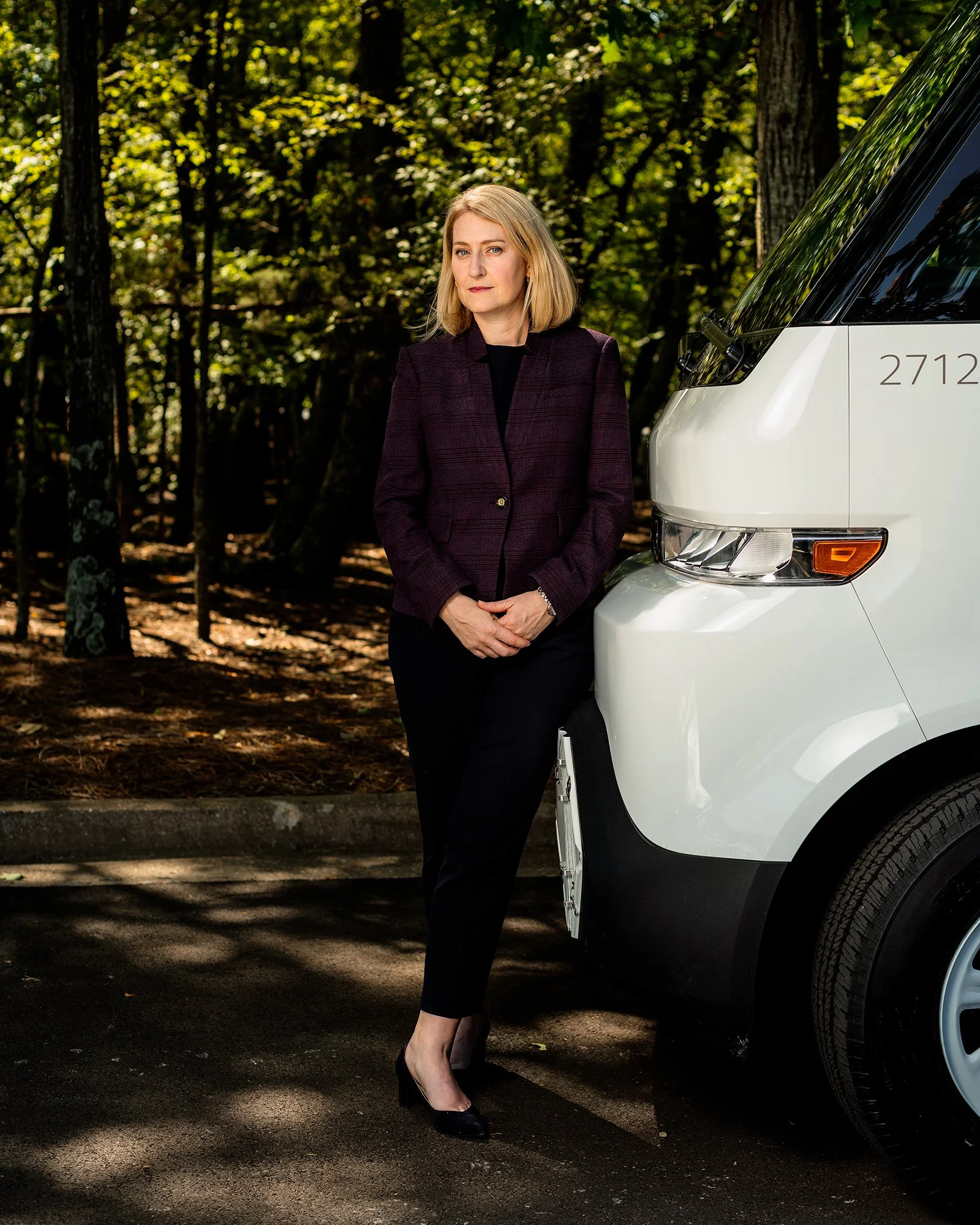 Brie Carere standing next to a new electric delivery van for FedEx in Memphis, Tennessee