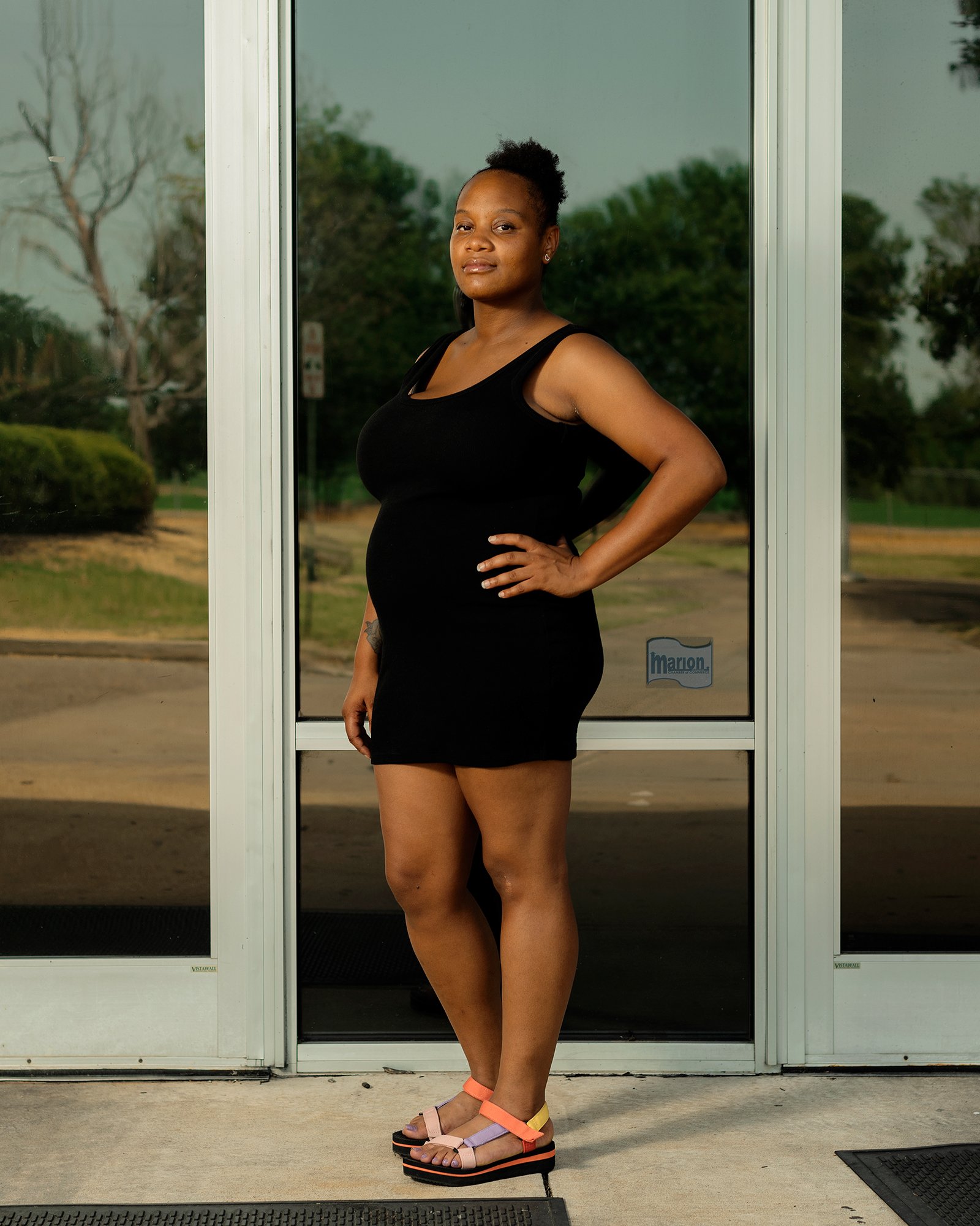 A Family Dollar employee stands outside a Family Dollar distribution center in West Memphis, Arkansas