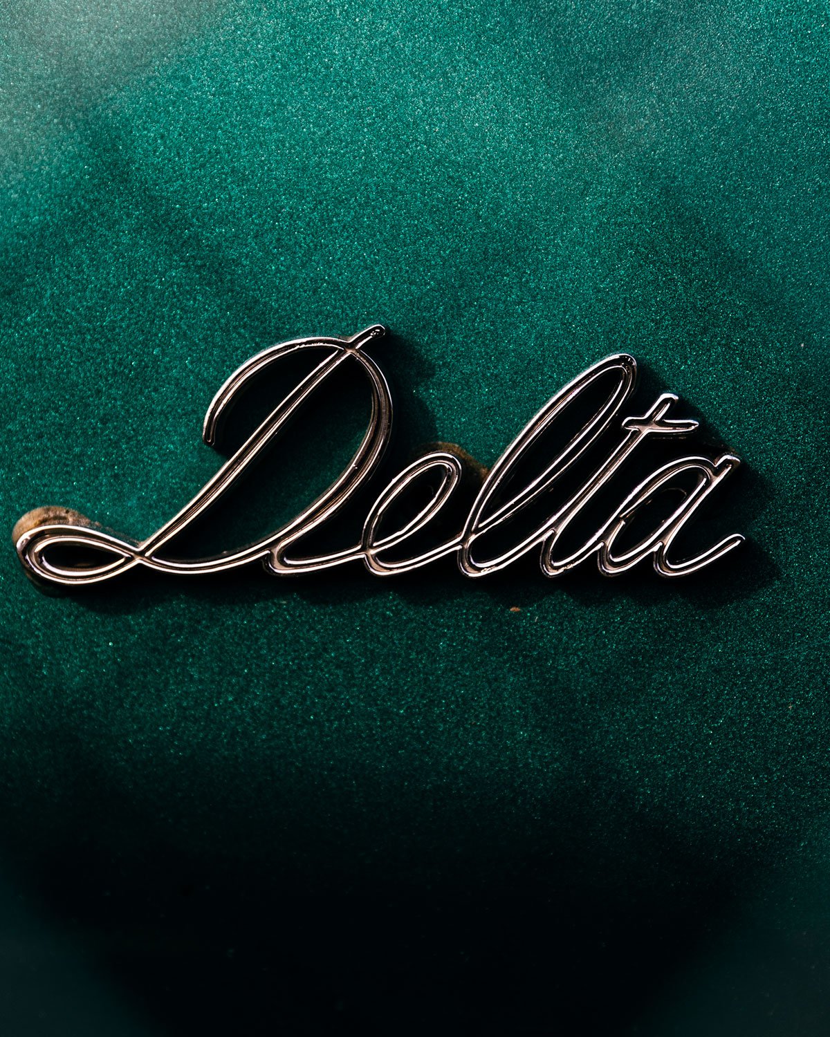 A car badge titled Delta
