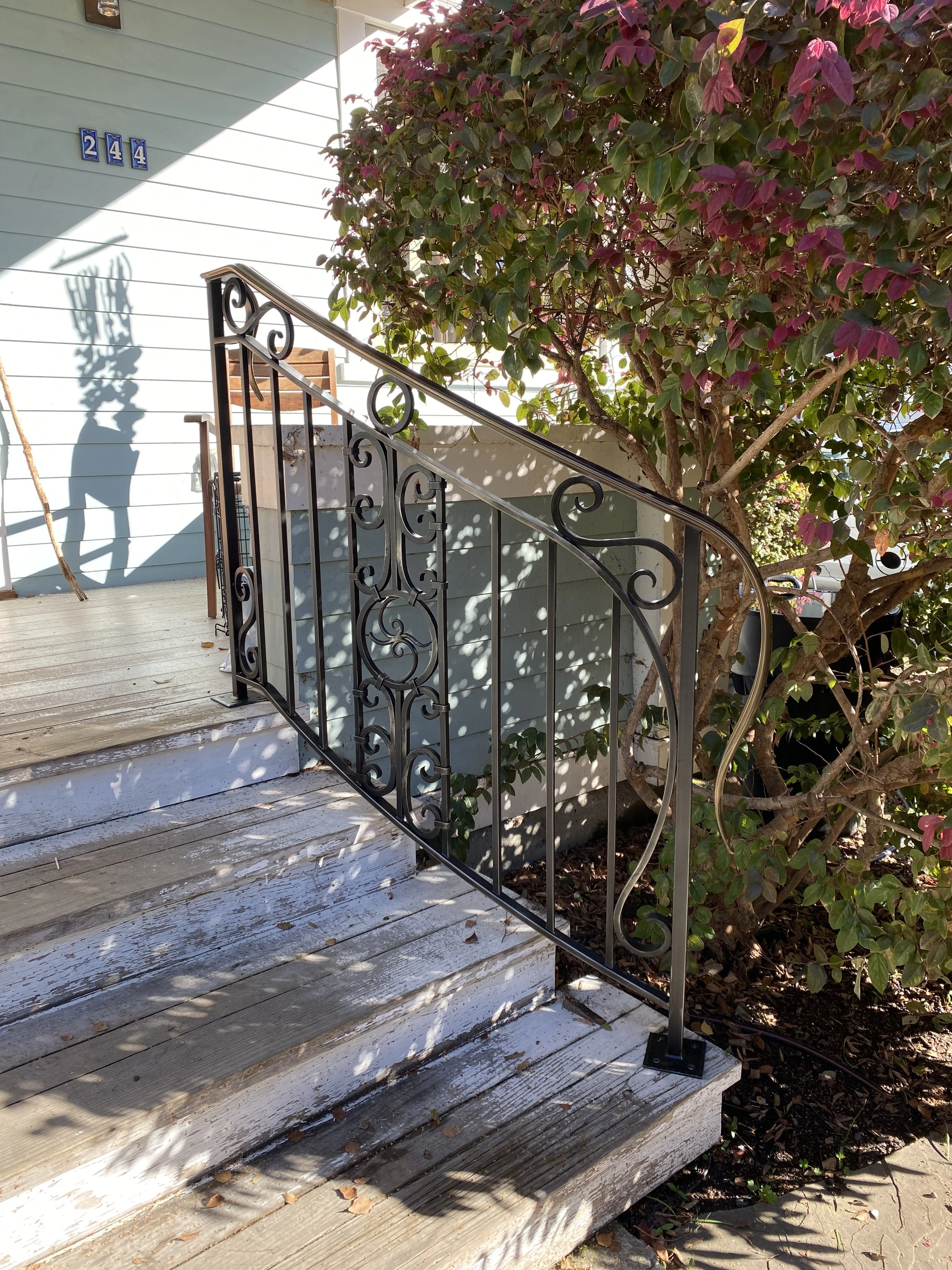Steel Scroll Railing with Bonze Cap Rail