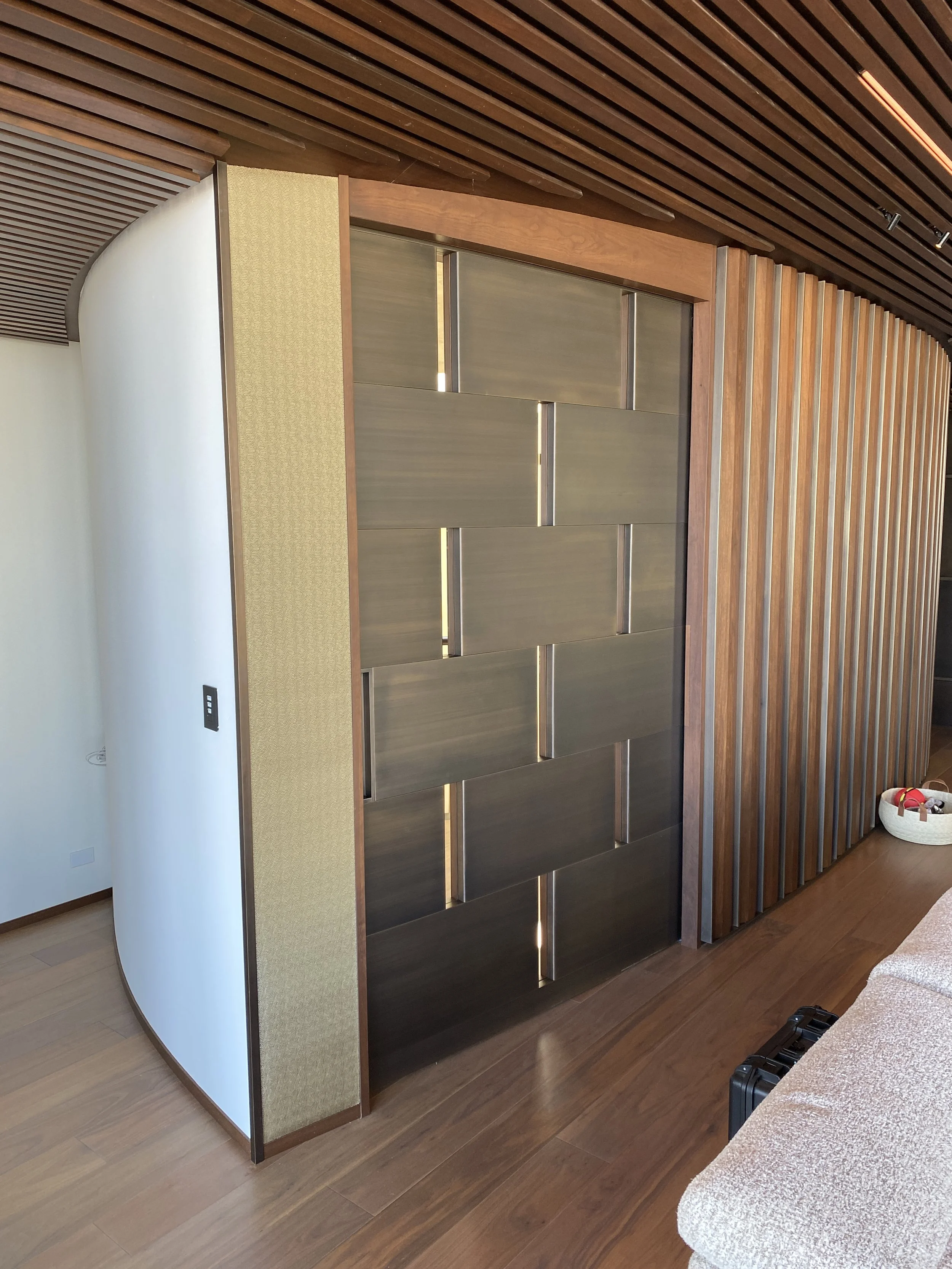 Bronze Clad Sliding Pocket Door with a Brushed Finish