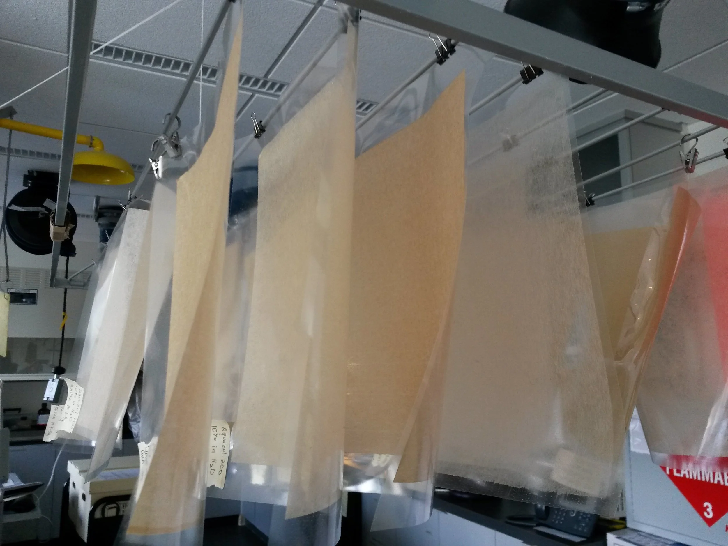 Tan, beige, and cream heat-set tissues hanging vertically.