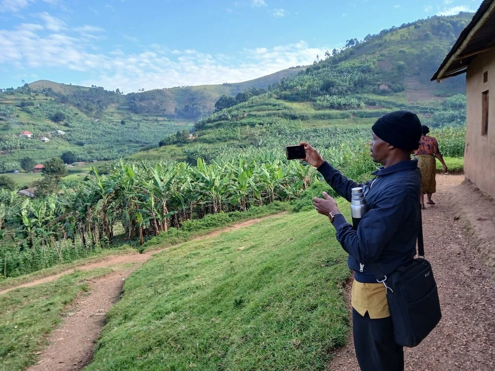Young Geoffrey Taking a Photo at Jojo_s beautiful Village.jpg