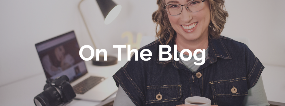 A female looking at the viewer holding a cup of tea with a computer and camera in the background.  The words on the blog are imposed over the picture.