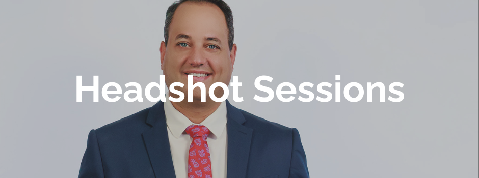 professional headshot taken in studio of a man in blue suit against a white background