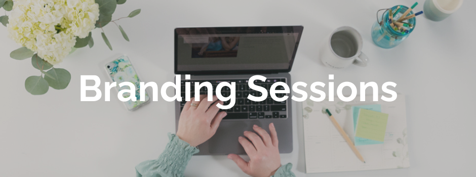 view of modern desk from above with woman working on laptop