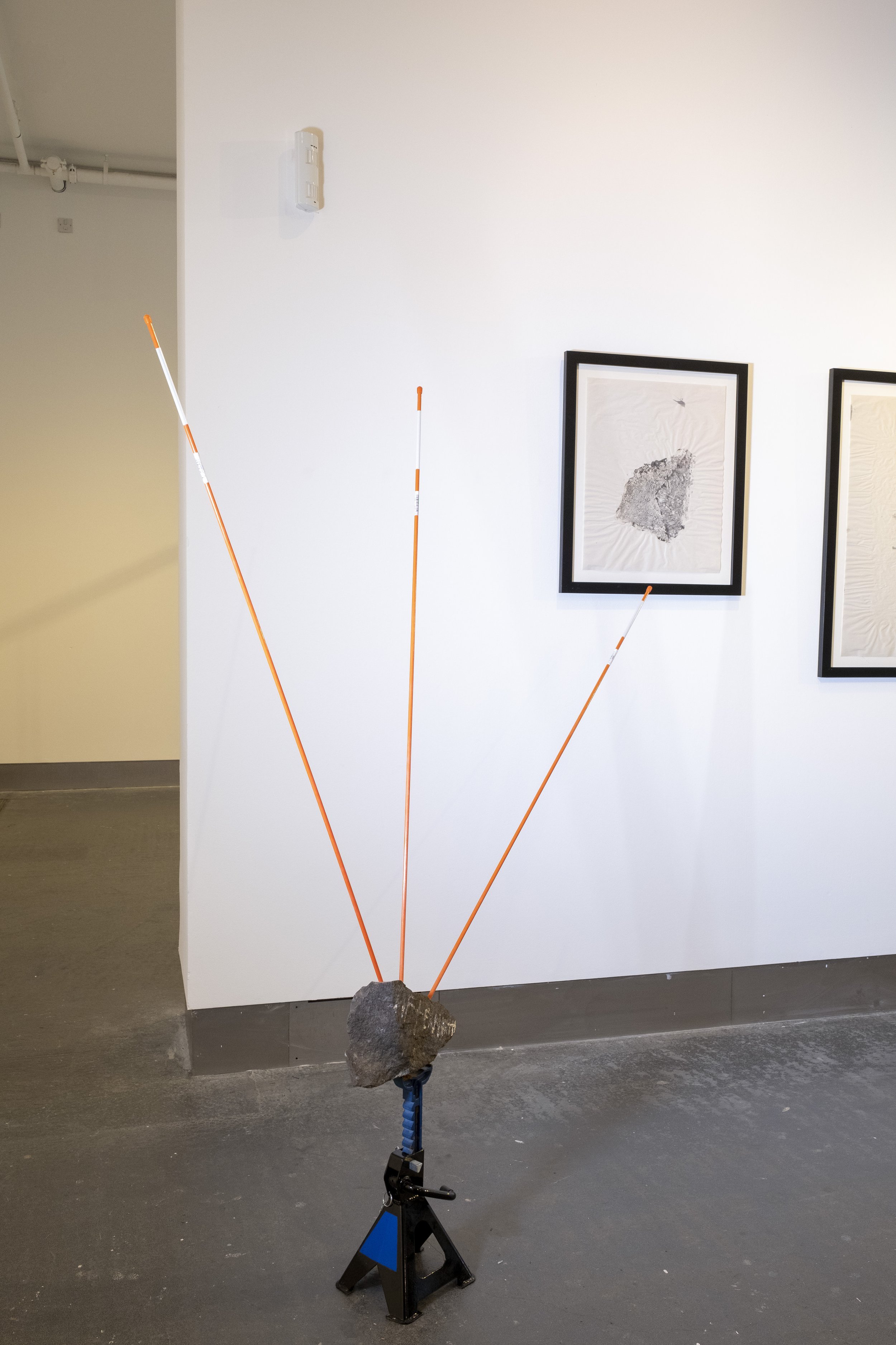 Shore Stones, 2021, installation view, ink on newsprint and stone. A Remix of Damage, Strata Collective, Reid Gallery, The Glasgow School of Art, 2022. © McAteer Photograph