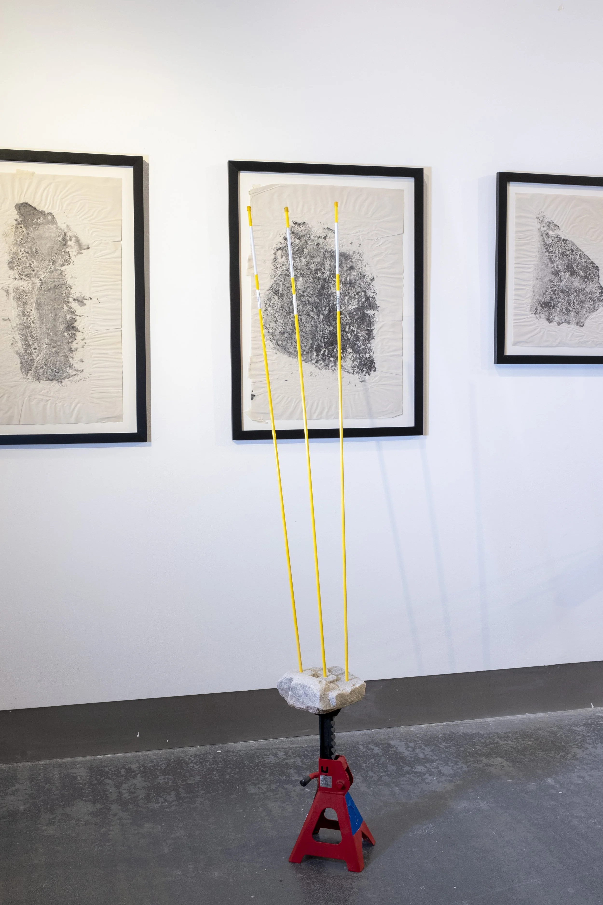 Shore Stones, 2021, installation view, ink on newsprint and stone. A Remix of Damage, Strata Collective, Reid Gallery, The Glasgow School of Art, 2022. © McAteer Photograph