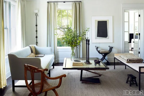 This room has two versions of a chair with an x-shaped base.. The chair in the foreground is usually called a curule chair and the stool/chair in the rear, a Savonarola chair, but both are in the same family.