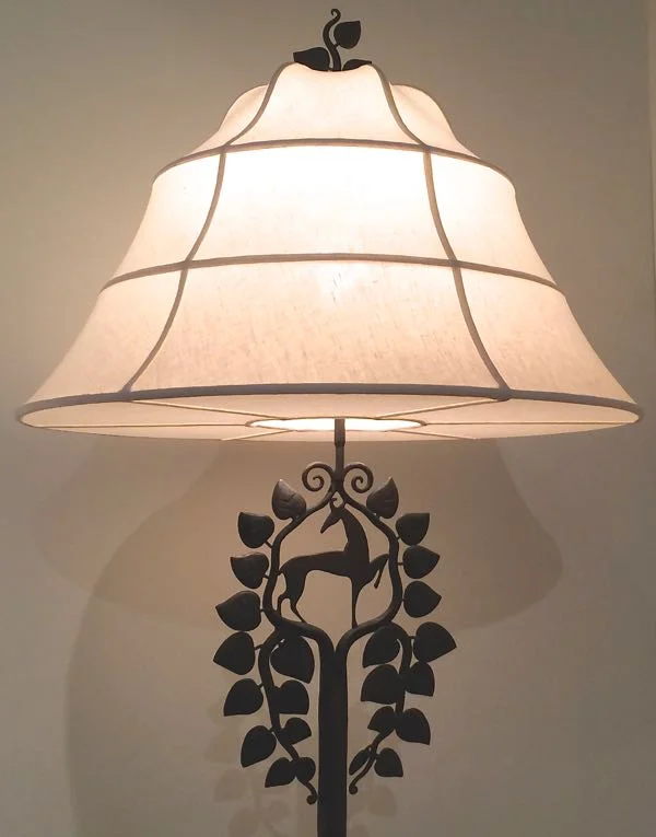 4. Who designed this beautiful figural floor lamp?