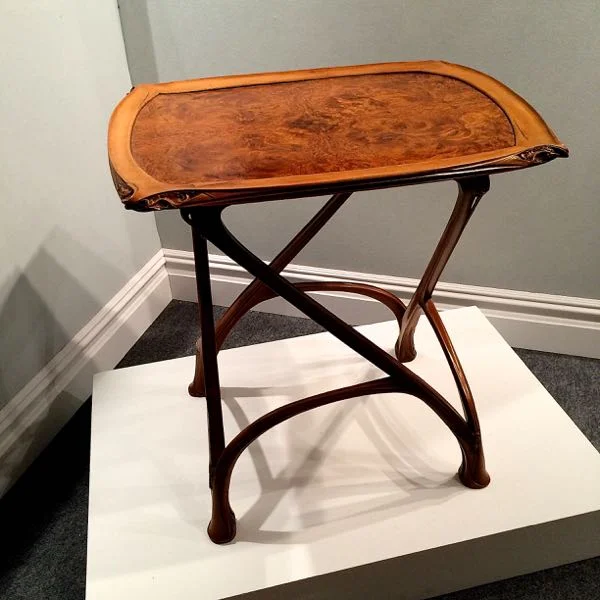 5. What is the name of the designer of this metal work and table? Bonus points if you know the name of the period.