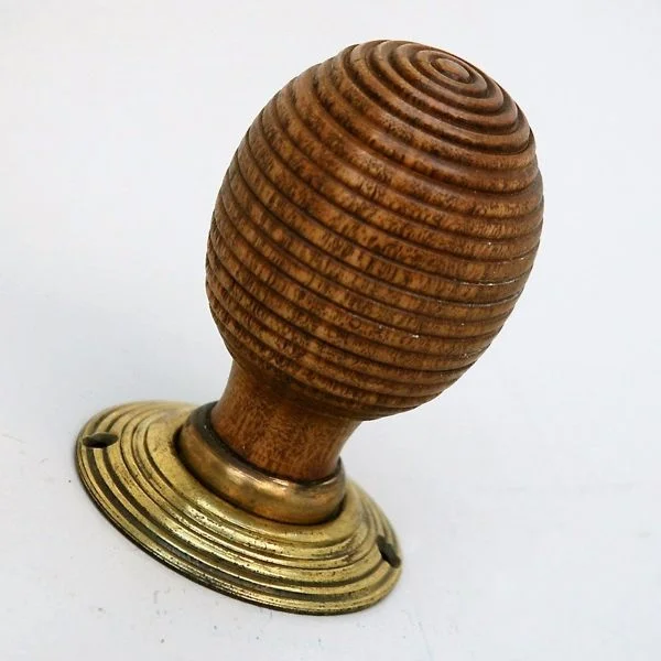 Beehive doorknob with reeding.