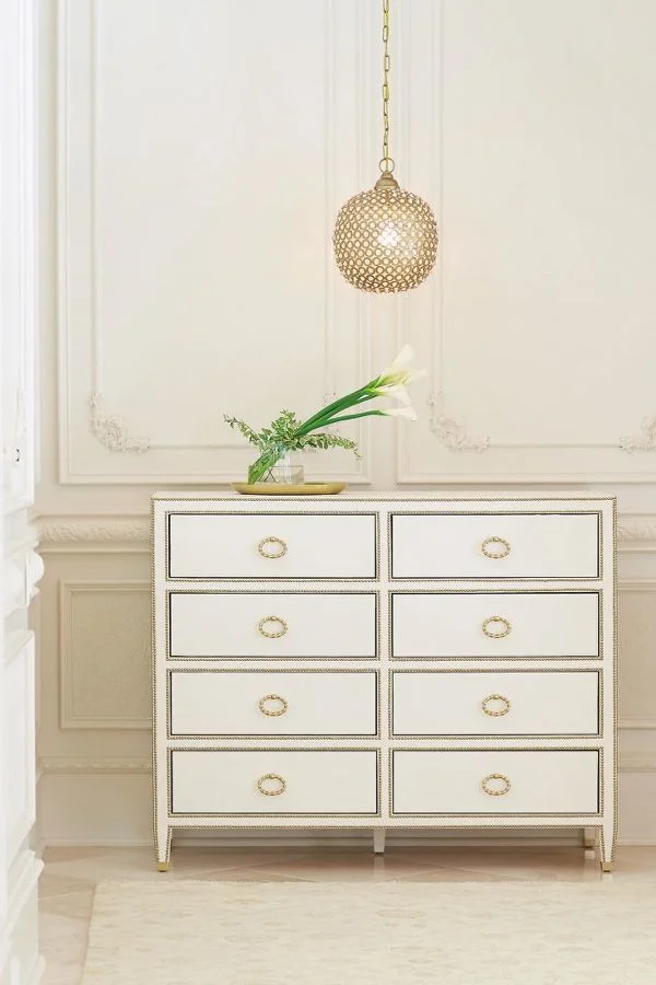 Bernhardt's Jet Set Dresser with brass plated ferrules on the feet of the dresser.