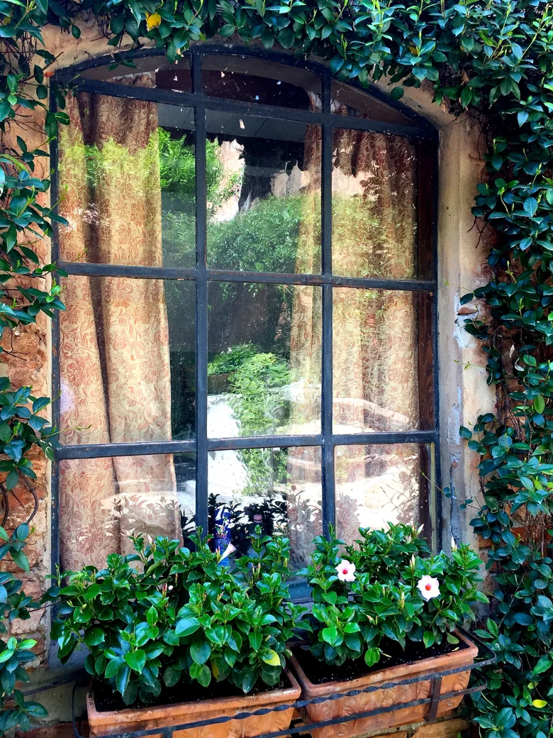 A peek inside La Contessa's home at Fortuny in Venice with their fabric covering the windows (natch)