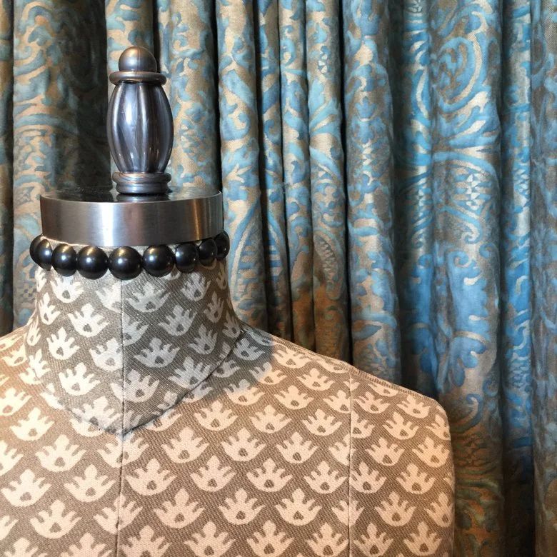 Mannequin and drapery fabrics in the Fortuny showroom in Venice